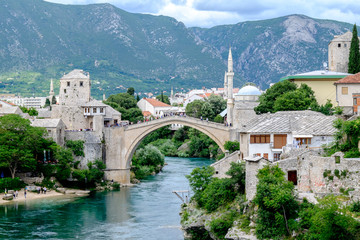 Fototapeta na wymiar The majestic ancient Stari Most bridge proudly spans the Neretva river, connecting the two halves of the city of Mostar for centuries.