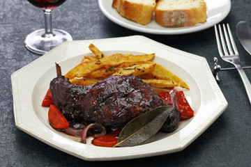 rabbit cooked in red wine with french fries