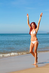 Woman walks on the beach