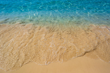 Fototapeta na wymiar Wave of the sea on the sand beach