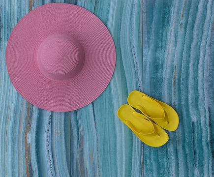 summer pink beach straw hat isolated on sea background