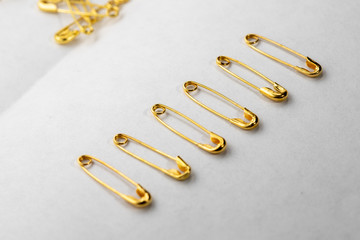 golden pins on white background