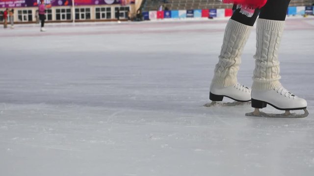 Closeup skating shoes ice skating outdoor at ice rink 4k