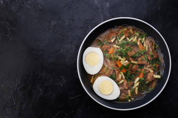 Home food Asia, Vietnam, egg noodle soup, colorful food ingredient for this food such as egg, beef, broth, ginger, soy sauce, carrot, vegetable