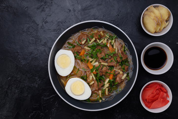 Home food Asia, Vietnam, egg noodle soup, colorful food ingredient for this food such as egg, beef, broth, ginger, soy sauce, carrot, vegetable