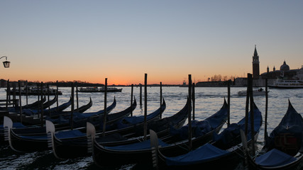 Venice Sunrise with nobody, Black Gondola and Golden Sun Light over the Grand Canal