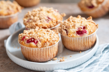Fresh homemade delicious raspberry muffins on a table