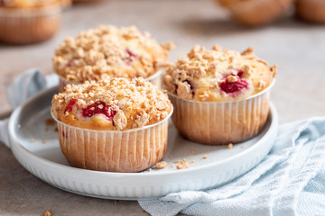 Fresh homemade delicious raspberry muffins on a table