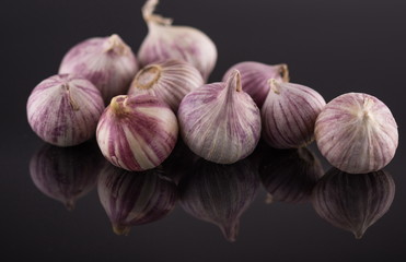 Studio shot of Garlic,on an acrylic black table