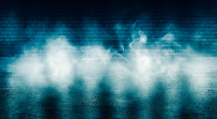 Obraz na płótnie Canvas Background of empty dark room with brick walls, illuminated by neon blue lights with laser beams, smoke
