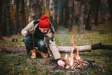 Young blogger photographer travel in mountain forest