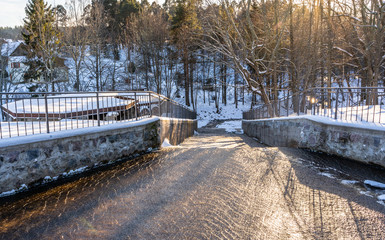 Photo of an Water Flowing in Park on Sunny Winter Day