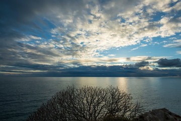 Sunset on the Adriatic. Autumn sky over the sea. Blurred background.