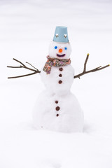 Snowman in the snow, at winter park.