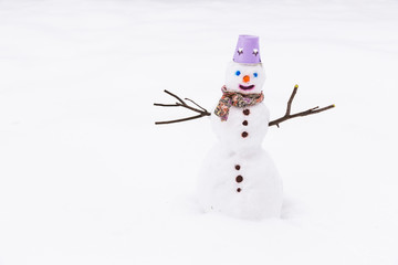 Snowman in the snow, at winter park.