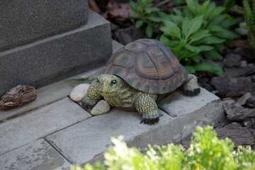 A Cute Stone Turtle Made of Stone in a Lovely Yard Setting