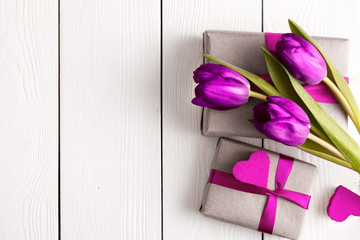 romantic gift boxes with flowers on white wooden background