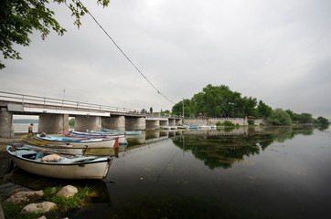 Boats on lake are tied under a bridge in Golyazi village, Bursa / Turkey