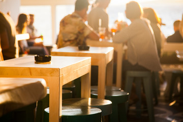 sunset bar by the beach - focus on table