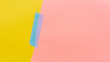 Coral peach and yellow paper background with silver washi tape - zine culture concept