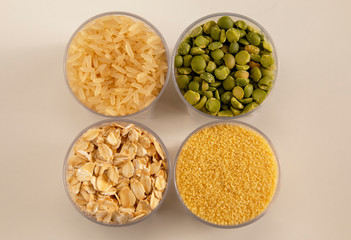 Cereals, rice, peas, couscous, oatmeal, in transparent containers, view from above