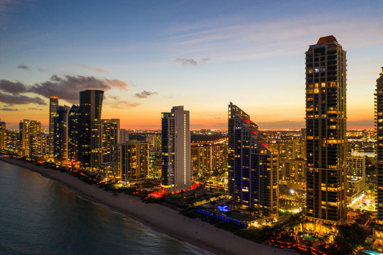 Highrise resorts in South Florida beachfront aerial twilight image