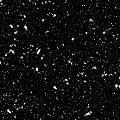 Snow falls on black background