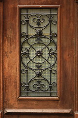old  wooden door,wrought iron window