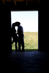 silhouette cowboy kiss