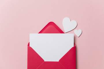 Love letter. white card with red paper envelope mock up - obrazy, fototapety, plakaty