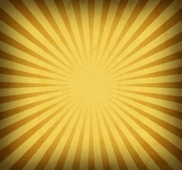 Yellow retro sunburst background design with vintage vignette and texture, cool groovy sun rays or beams in striped radial pattern