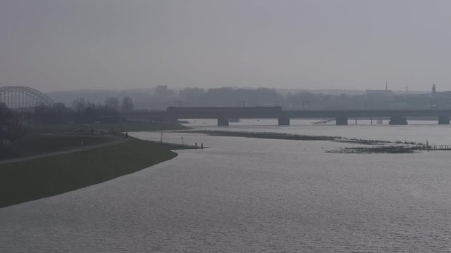 flooded river Waal with Nijmegen in background