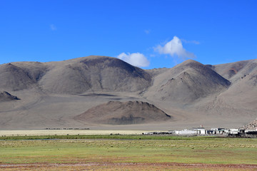 Fototapeta na wymiar In the footsteps of Roerich's expedition. Beautiful colorful mountains in Tibet in summer , China