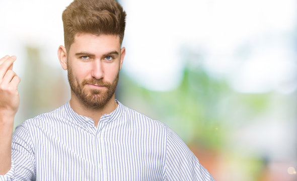Young handsome man Doing Italian gesture with hand and fingers confident expression