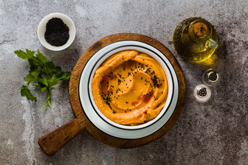 Delicious vegan hummus with sweet potato and canned artichokes. with black sesame. tasty snack of...