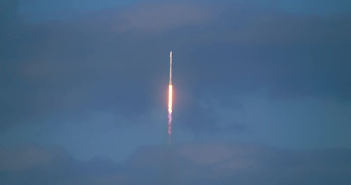 Commercial rocket flying into space in 4K at  120 fps slow motion.  Lots of nice flames and smoke against a dramatic sky.
