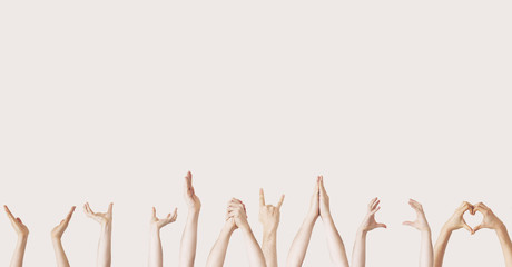 Multiple female hand gestures on gray background