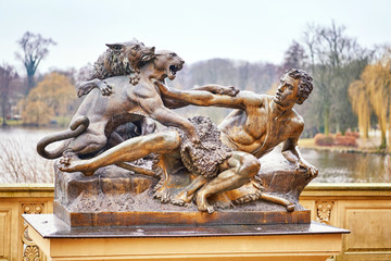 Shepherd and dog attacked by a panther. Sculpture in Schwerin Mecklenburg-Vorpommern. - Powered by Adobe