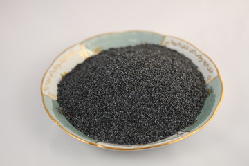 Macro of dried poppy seeds as a background.