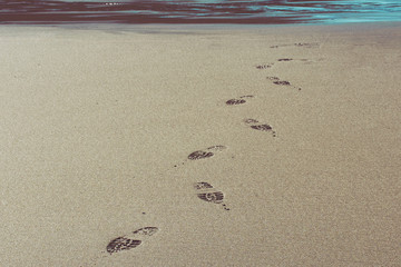 shoe prints in the sand on Trebarwith strand beach