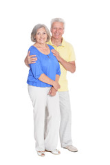 Happy senior couple posing on white background
