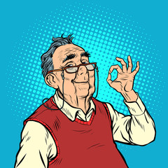 Fototapeta premium smile elderly man with glasses okay gesture