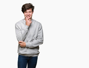 Young handsome sporty man wearing sweatshirt over isolated background looking confident at the camera with smile with crossed arms and hand raised on chin. Thinking positive.