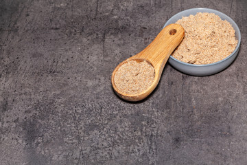 Minced seeds of a milk thistle (Silybum marianum) on dark background