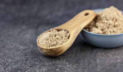 Minced seeds of a milk thistle (Silybum marianum) on dark background
