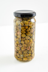 capers bottle on a white background in bottle with clipping path