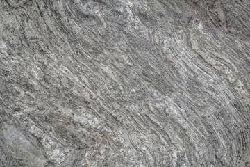 Gray rough texture of natural stone. Horizontal gray background. Suitable for design.