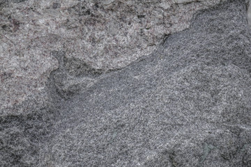 Gray rough texture of natural stone. Horizontal gray background. Suitable for design.