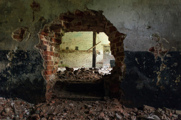 Hole in the wall. Brick wall. Broken wall.