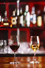 glasses of red and white wine in the bar